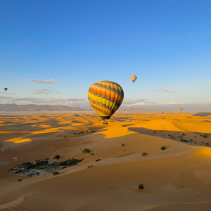Experience the ultimate Dubai adventure with a Hot Air Balloon Desert Safari. Fly over golden dunes at sunrise, witness in flight falcon displays. Safari , Desert Safari 2025 , Dubai Adventures , Falcon Show Sky , Luxury Desert Camp , Desert Photography , Luxury Balloon Experience , Luxury Balloon Experience.